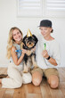 © Cavan - young couple with celebrating their dogs birthday