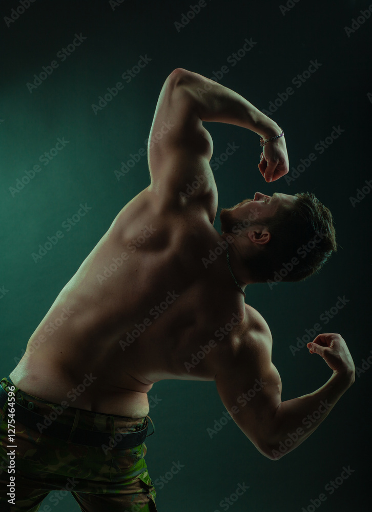 Hot man undressing seductively. Masculine fitness sexy model flexing