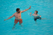 © Volodymyr - Cute excited child with dad in summer swimming pool. Father and child having fun in summer pool. Father and son swimming in pool. Family at aquapark. Dad and son in pool on summer weekend.