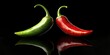 © Gular - Red and green chili peppers with droplets displayed symmetrically against a glossy black reflective background creating visual contrast and texture