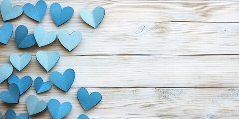 Poster - Blue paper hearts scattered across a light wooden background with subtle grain texture creating an inviting and romantic ambiance.