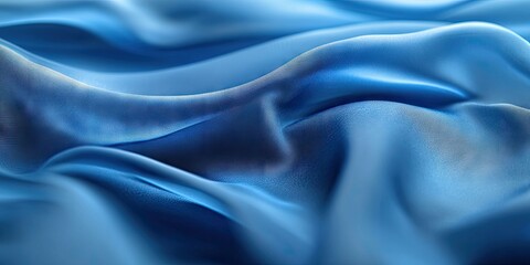 Leinwandbilder - Soft flowing blue silk fabric with gentle waves creating elegant textures and shadows in varying shades of blue, ideal for luxurious backgrounds.