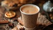 © meristock - Aromatic chai tea in a textured brown paper cup with steam rising, surrounded by star anise, cinnamon sticks, and dried citrus on a rustic wooden table