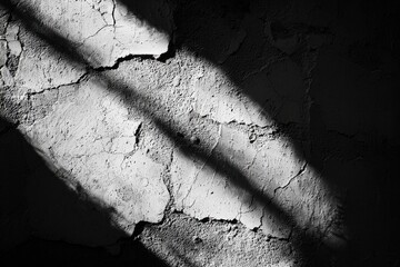 Poster - a close-up of a heavily textured and cracked concrete wall with a dramatic diagonal shadow creating 