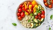 © fivan - A vibrant quinoa and roasted vegetable bowl with colorful bell peppers, zucchini, and cherry tomatoes, set against a clean white marble background