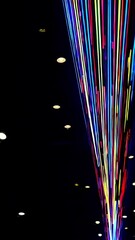 Poster - Vivid laser light stream converging in darkness with pulsating energy patterns