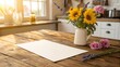 © Володимир Виповський - Sunlit Wooden Table with Fresh Flowers with a blank sheet of paper