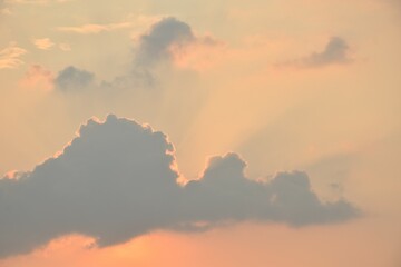 Wall Mural - sunlight spreading through cloud on sunset orange sky in evening