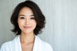 © Руслан Галиуллин - minimalistic portrait of beautiful Asian woman 35 years old in white bathrobe on white background