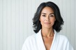 © Руслан Галиуллин - minimalistic portrait of adult elegant Asian woman 50 years old in white bathrobe on white background, copy space, mature, wellness