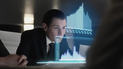 Poster - Businessman wearing professional attire analyzing holographic financial data projection, representing futuristic business technology and digital innovation in corporate environment