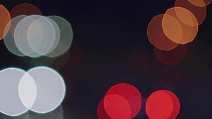Wall Mural - slow motion abstract defocused blur of city bokeh lights – dreamy urban nightscape, soft glowing orb