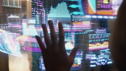 Fototapete - Businesswoman interacting with holographic futuristic interface analyzing financial market data, charts, and graphs in a technological business environment
