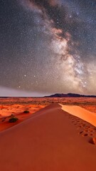 Wall Mural - Starry night sky over desert dunes creates breathtaking celestial view in a remote location