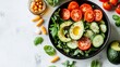 © Arc std. - Healthy salad bowl with avocado, tomatoes, cucumber, and supplements.
