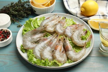 Sticker - Fresh raw shrimps and spices on light blue wooden table, closeup