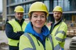 © Alexei - Construction workers in hard hats and safety vests pose for a photo