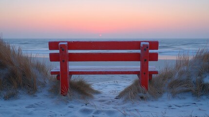 Canvas Print - Red bench on snowy beach at sunrise