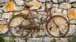 © Erika - un paisaje retro vintage de un bicicleta antigua de metal vintage deteriorada recargada sobre un muro o pared de piedra diseño envejecido
