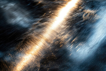 Poster - Striated metallic surface reflecting light, creating a dynamic interplay of gold and blue hues.