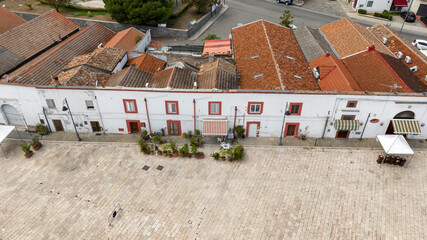 Wall Mural - Aerial view of white houses in a street in the historic center of Scanzano Jonico, Basilicata, Italy.