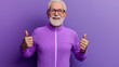 © GloWinChoice - Elderly man dressed in bright purple sportswear isolated on solid background, active lifestyle, shows sign and direction with hands, engaging in a dynamic activity