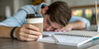 ©  Princess Turandot - Tired student resting head on desk with coffee, struggling with school workload