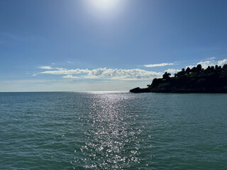 Wall Mural - beautiful sea, sun, sky and rocky coastline