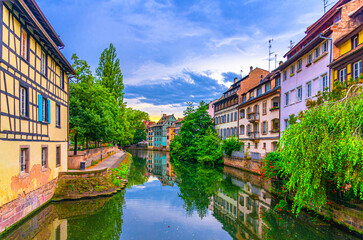 Wall Mural - The Petite France Quarter Quartier des Tanneurs, quay embankment River Ill canal with colorful houses medieval buildings in old town Strasbourg city historic Centre, Alsace Grand Est region, France