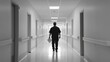 © Mcgui - Hospital discharge with a patient walking down a hospital corridor. Featuring strength and recovery