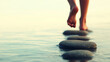 © Bonsales - Woman walking barefoot on stones in water, enjoying a moment of mindfulness and self discovery