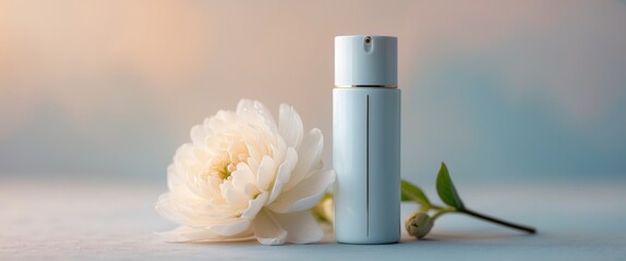 Wall Mural - Cosmetic bottle and delicate white flower on a pastel background