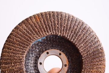 Poster - Close-up of a person holding a grinding wheel.