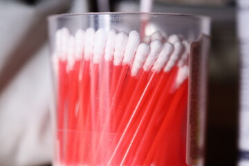 Poster - A unique arrangement of toothbrushes in a glass, highlighting their vibrant colors.