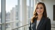 © TJ_Designs - beautiful smile woman wearing a business suit, standing in the office, sunshine, with a little bit of blurred background with copy space