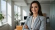 © TJ_Designs - beautiful smile woman wearing a business suit, standing in the office, sunshine, with a little bit of blurred background with copy space