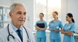 © TJ_Designs - A happy doctor in medical uniform, in a hospital with other nurses, with a little bit of blurred background with side copy space, with background sunshine