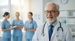 © TJ_Designs - A happy doctor in medical uniform, in a hospital with other nurses, with a little bit of blurred background with side copy space, with background sunshine