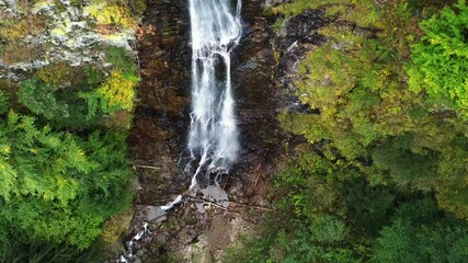 Poster - Stunning drone footage of Scorusu waterfall flowing between evergreen trees in hilly forest