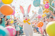 © Volodymyr - A playful Easter Bunny jumping through a vibrant Easter parade, surrounded by floating confetti, oversized eggs, and happy children celebrating.