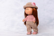 © Mila - Vinyl doll toy brown in stylish clothes, sale of toys, fashionable children's clothing, selective focus