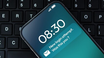 Poster - New login attempt notification appearing on the smartphone screen close-up, 4k footage with a keyboard in the backdrop.