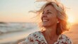 © LukaszDesign - Natural portrait of a joyful elderly woman by the shore at sunset. Emphasizes lifestyle theme
