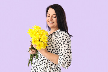 Wall Mural - Beautiful happy mature woman with bouquet of flowers on purple background. International Women's Day