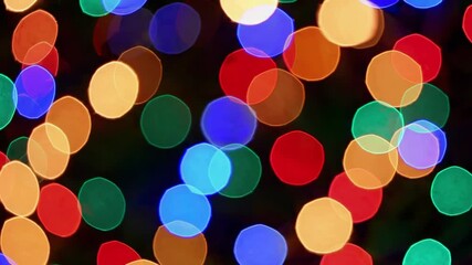 Poster - Colorful blurred bokeh lights in dark background, festive and vibrant pattern. Holiday celebration and abstract art concept