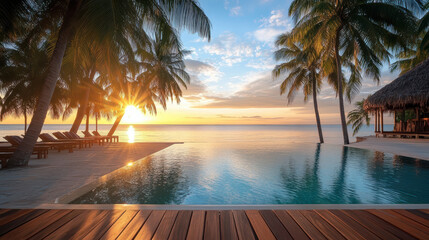 Wall Mural - picturesque sunset at tropical resort with palm trees and pool