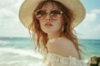 © HO - A high-fashion summer editorial image capturing a woman in sunglasses and a sun hat, exuding effortless elegance by the ocean.
