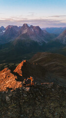 Wall Mural - aerial mountains view - people hiking in northern norway couple man and woman travel extreme active 