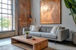 © HO - A chic loft interior with a stylish grey sofa, a large rose gold abstract painting on the wall, and a sleek wooden coffee table, elegant and modern