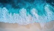 © Abuabdurrahman - Aerial view of turquoise waves crashing on a pristine beach